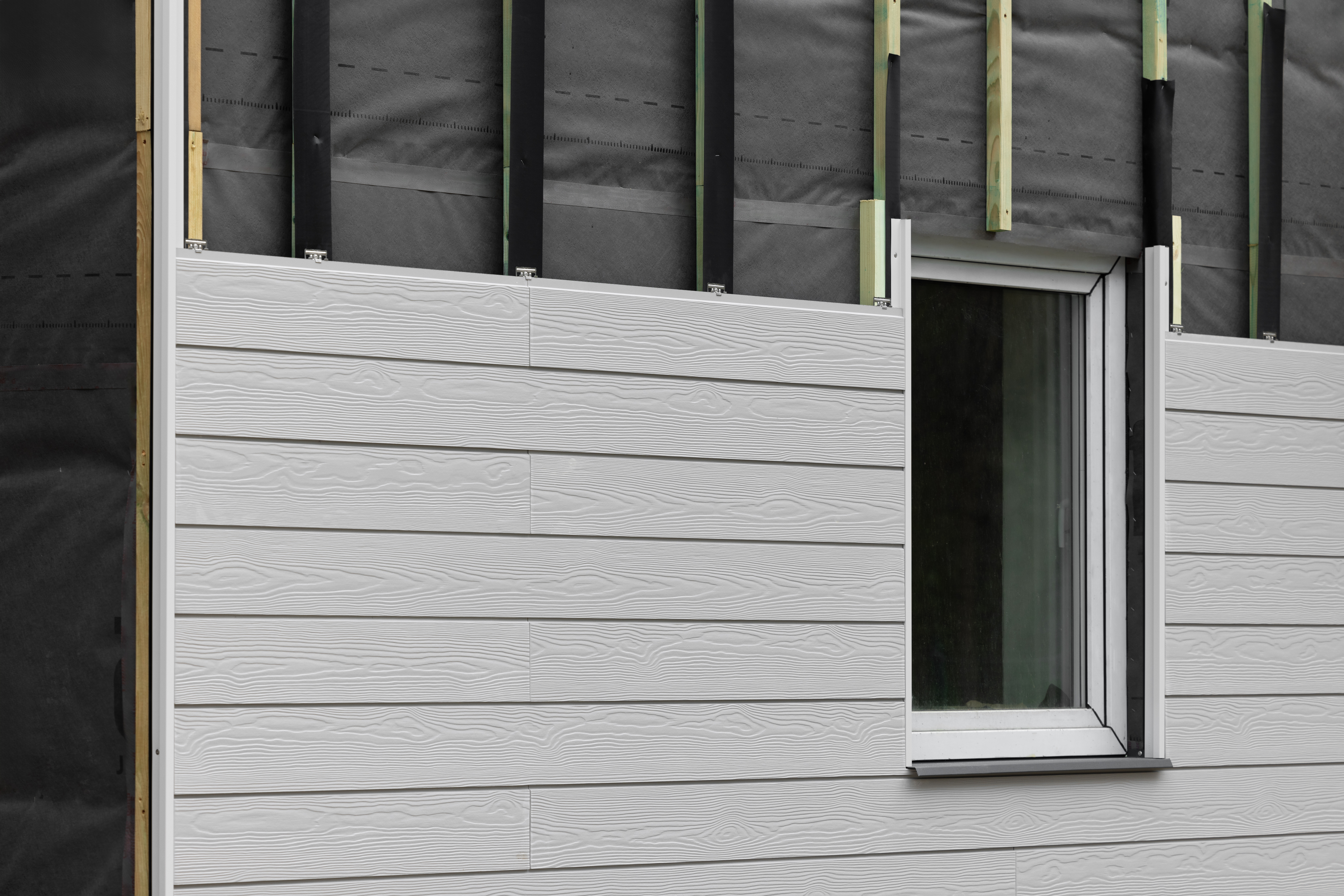 Adhesive Dispensing for Siding & Exterior Panels | UNIFLOW